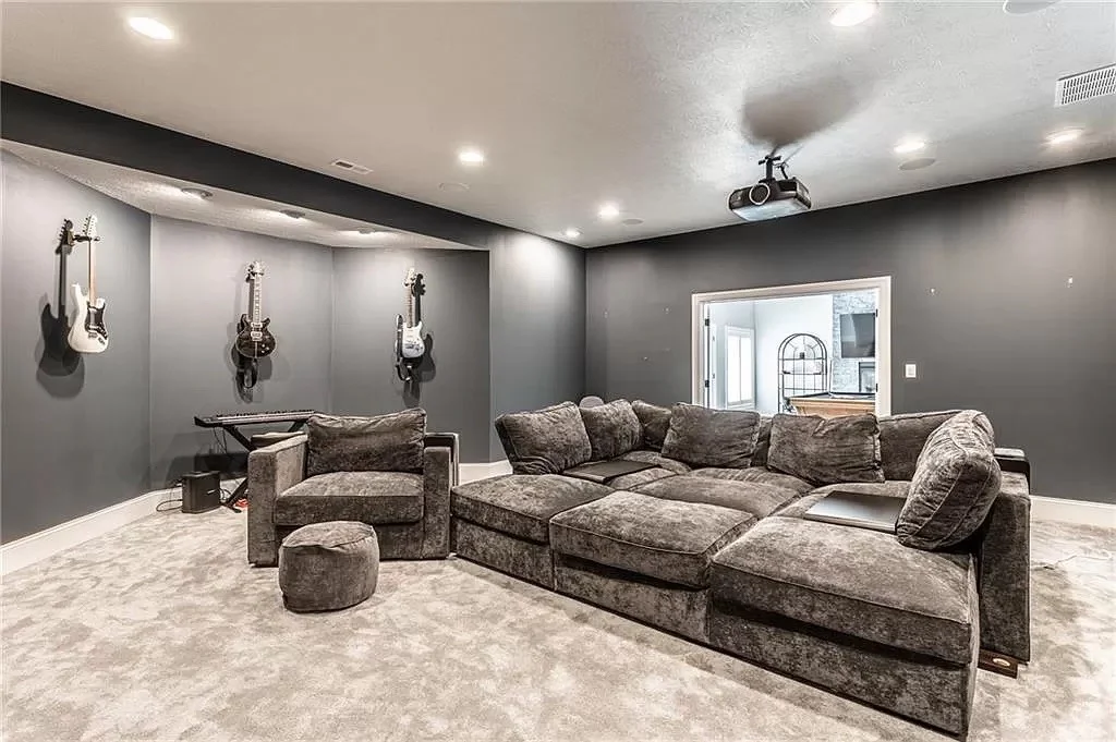 Holiday home — basement media room after