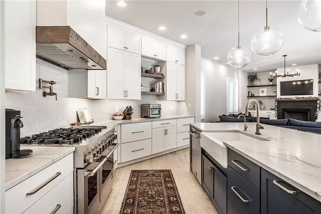 Small kitchen remodel in Brownsburg Indiana with updated cabinets, light countertops, and under-cabinet lighting